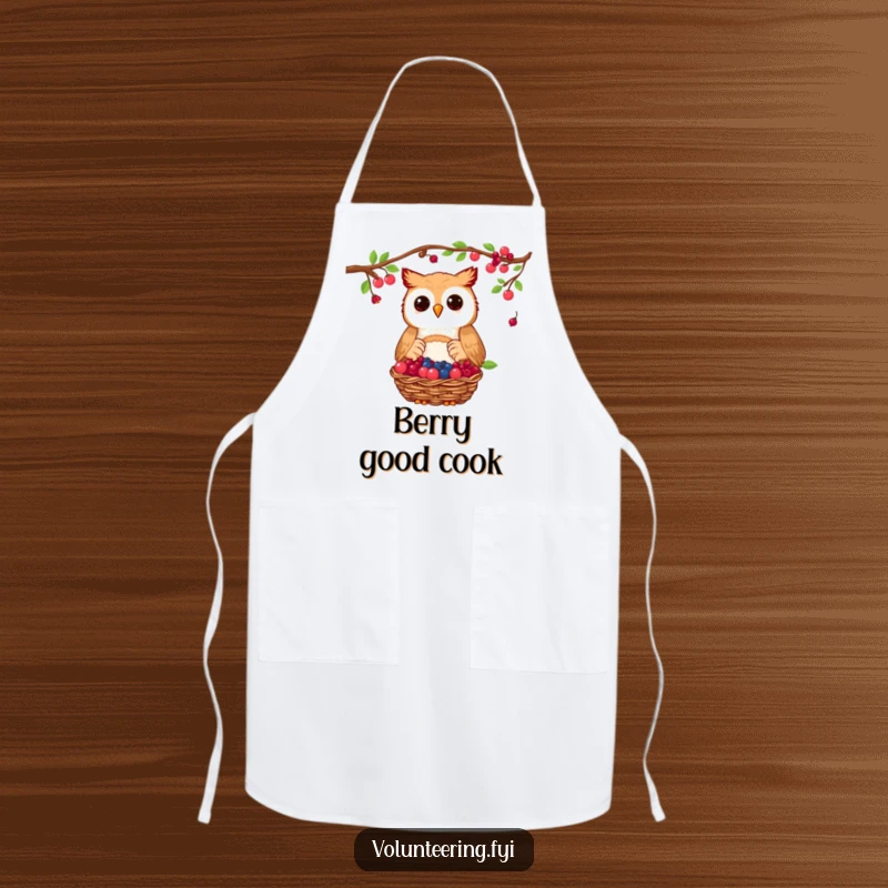 Funny owl apron showing a proud owl donating a basket of collected berries, a cute kitchen accessory for generous cooks.