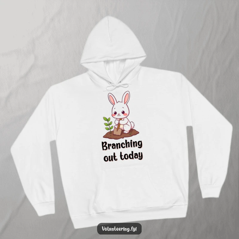 Funny Hoodie with a cute bunny character diligently planting a small tree using a shovel, embodying a helpful and nurturing spirit.