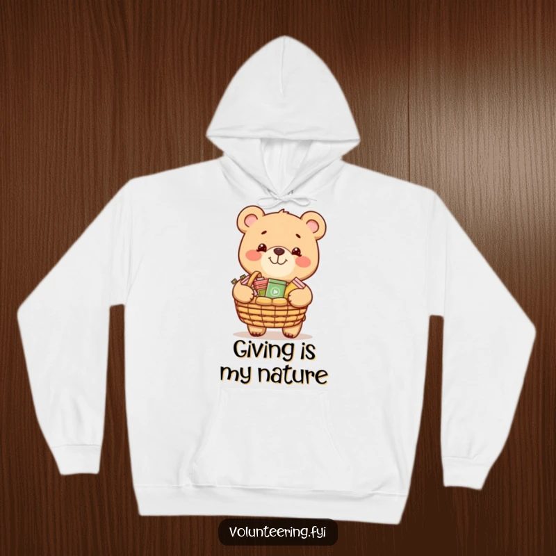 Funny hoodie depicting a grinning bear carrying a basket of donated items, cozy wear for charitable people.