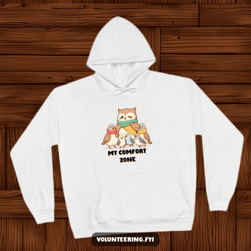 Funny owl hoodie showing a caring owl sharing blankets with chilly pigeons, providing ultimate comfort and a heartwarming funny gift.