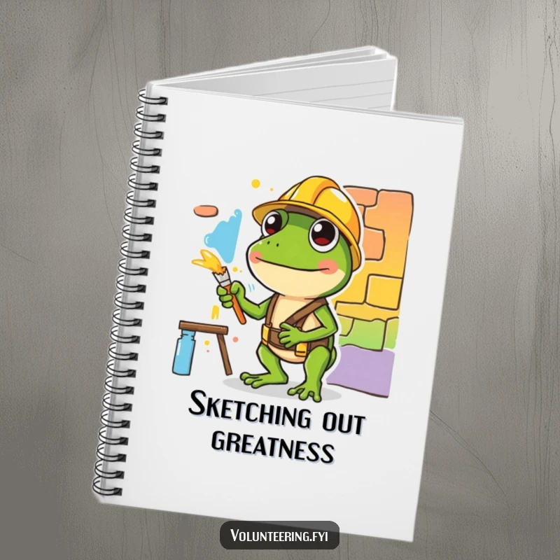 Funny notebook cover featuring a diligent green frog in a hard hat painting, inspiring creativity and focus with humor.