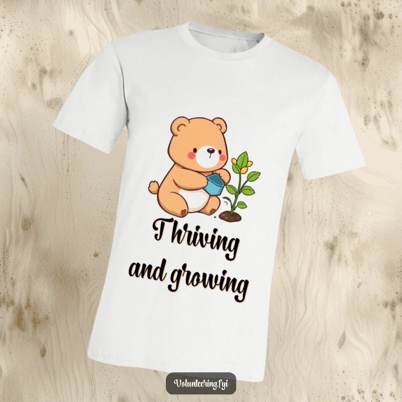 Funny bear t-shirt, a happy cartoon bear gently watering a tiny sprouting plant, showing care and contentment.