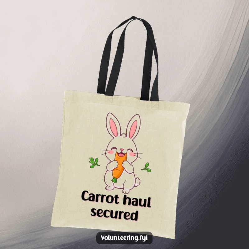 Funny tote bag showcasing a joyful rabbit splitting a big carrot down the middle, perfect for market trips and laughs.